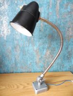 A vintage wall-mounted or table lamp for architects